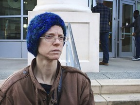 In this Dec. 14, 2017 photo, Adele MacLean talks to reporters outside Atlanta's municipal court after her ticket for refusing to stop feeding the homeless in an Atlanta park was dropped. Volunteers who feed the homeless in public places say they're providing a needed service. But city governments and some advocates say their well-meaning efforts can hinder long-term solutions and raise sanitation concerns.