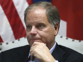 In this photo taken Wednesday, Dec, 13, 2017, Democrat Doug Jones speaks during an interview with the Associated Press, in Birmingham, Ala. Jones said he knew he had a path to victory. He said his win signals that voters are looking for a less vitriolic political rhetoric and vanquished the idea that a Democrat could not win in Alabama.