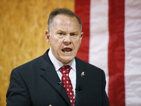 FILE- In this Nov. 30, 2017 file photo, former Alabama Chief Justice and U.S. Senate candidate Roy Moore speaks at a campaign rally, in Dora, Ala. In the Alabama Senate race, national Democrats and the liberal grassroots are treading lightly, trying not to sink Doug Jones' upset bid against Republican Roy Moore.