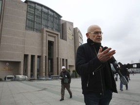 German writer and journalist Gunter Wallraff, talks to members of the media outside a court where the trial of German journalist Mesale Tolu for terror propaganda and terror group membership, continues in Istanbul, Monday, Dec. 18, 2017. Media reports say prosecutors are requesting that a German journalist who was arrested in Turkey be released from jail pending the outcome of her trial on terror-related charges.