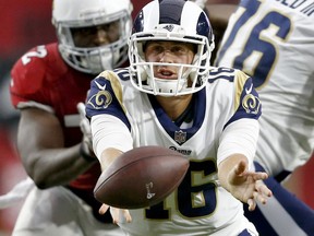 Los Angeles Rams quarterback Jared Goff (16) hands off against the Arizona Cardinals during the first half of an NFL football game, Sunday, Dec. 3, 2017, in Glendale, Ariz.