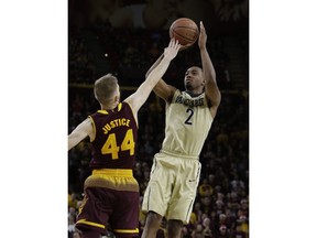 Vanderbilt guard Joe Toye (2) shoots over Arizona State guard Kodi Justice in the first half during an NCAA college basketball game, Sunday, Dec 17, 2017, in Tempe, Ariz.