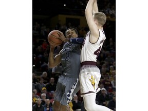 Longwood guard B.K. Ashe (2) drives on Arizona State guard Kodi Justice in the first half during an NCAA college basketball game, Tuesday, Dec 19, 2017, in Tempe, Ariz.