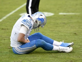 Detroit Lions quarterback Matthew Stafford reacts after injuring his hand in the second half of an NFL football game against the Baltimore Ravens, Sunday, Dec. 3, 2017, in Baltimore.