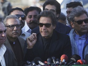 Pakistani opposition leader Imran Khan speaks to reporters in Karachi, Pakistan, Friday, Dec. 15, 2017. Pakistan's top court has rejected a petition seeking the disqualification of Khan from office for allegedly concealing foreign assets.