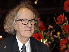 FILE - In this Saturday, Feb. 11, 2017, file photo, Australian actor Geoffrey Rush arrives for the screening of the film 'Final Portrait' at the 2017 Berlinale Film Festival in Berlin, Germany. Rush is suing a Sydney newspaper for allegedly portraying him as a sexual predator in its reporting of an actress's complaint of "inappropriate behavior" against the Oscar-winning actor.