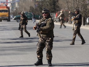 Security personnel arrive outside the site of a suicide attack in kabul, Afghanistan, Thursday, Dec. 28, 2017.