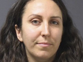 This booking photo released Monday, Dec. 11, 2017, by the University of Connecticut Police Department shows Catherine Gregory, who turned herself in on Sunday to face charges of attempted larceny and disorderly conduct for taking notes from the lectern while Lucian Wintrich was speaking on the UConn campus on Nov. 28. (University of Connecticut Police Department via AP)