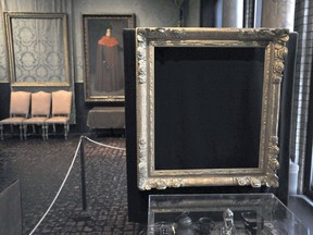 FILE - In this March 11, 2010, file photo, empty frames from which thieves took "Storm on the Sea of Galilee," left rear, by Rembrandt and "The Concert," right foreground, by Vermeer, remain on display at the Isabella Stewart Gardner Museum in Boston. Midnight Dec. 31, 2017, is the deadline to collect a doubled reward being offered for information leading to the recovery of 13 works worth an estimated $500 million.