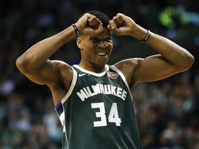 Milwaukee Bucks' Giannis Antetokounmpo reacts to a foul called against his team during the first quarter of an NBA basketball game against the Boston Celtics in Boston, Monday, Dec. 4, 2017.
