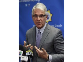 San Francisco District Attorney George Gascon gestures during a media conference on Tuesday, Dec. 5, 2017, in San Francisco. Gascon is defending the handling of a murder trial that ended with the acquittal of a Mexican man whose arrest set off a fierce national debate on immigration. Gascon said Tuesday that he still believes Jose Ines Garcia Zarate should have been convicted of murder in the 2015 death of Kate Steinle.