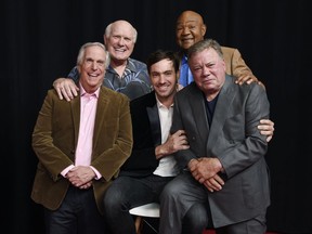 In this Wednesday, Nov. 29, 2017, photo, from left, Henry Winkler, Terry Bradshaw, Jeff Dye, George Foreman and William Shatner, cast members in the NBC reality series "Better Late Than Never," pose together at NBCUniversal Studios in Universal City, Calif. After traipsing across Asia in the first season of the travelogue reality show "Better Late Than Never," Foreman, Bradshaw, Winkler and Shatner are reuniting for a tour of Europe in season two, which premieres New Year's Day on NBC.