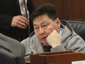 File - In this Jan. 17, 2017 file photo, state Rep. Dean Westlake, D-Kotzebue, talks with another legislator during a break in the opening session of the Alaska Legislature in Juneau, Alaska. The rural Alaska lawmaker has refused calls that he resign amid allegations of inappropriate behavior from seven women. Westlake issued a statement Tuesday evening, Dec. 12, 2017, saying he plans to stay in office.