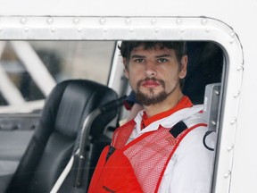FILE - This Sept. 27, 2016 file photo shows Nathan Carman arriving in a small boat at the US Coast Guard station in Boston. A New Hampshire judge is scheduled on Friday, Dec. 15, 2017, to hear arguments to dismiss a lawsuit accusing Carman of killing his millionaire grandfather and possibly his mother to collect an inheritance. No one has been arrested. Carman has denied any involvement in either case.