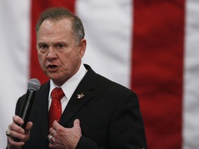 FILE- In this Dec. 11, 2017, file photo, U.S. Senate candidate Roy Moore speaks at a campaign rally in Midland City, Ala. Moore is going to court to try to stop Alabama from certifying Democrat Doug Jones as the winner of the U.S. Senate race. Moore filed a lawsuit Wednesday evening, Dec. 27, 2017, in Montgomery Circuit Court.