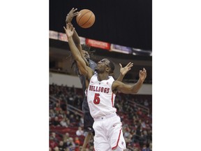 Fresno State's Jahmel Taylor drives against Nevada's Lindsey Drew, rear, during the first half of an NCAA college basketball game in Fresno, Calif., Wednesday, Dec. 27, 2017.