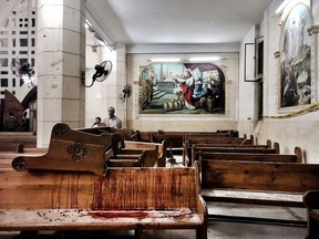 Blood stains pews inside the St. George Church after a suicide bombing, in the Nile Delta town of Tanta, Egypt, Sunday, April 9, 2017. Bombs exploded at two Coptic churches in the northern Egyptian cities of Tanta and Alexandria as worshippers were celebrating Palm Sunday, killing over 40 people and wounding scores more in assaults claimed by the Islamic State group.