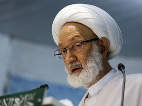 FILE -- In this Nov. 21, 2014 file photo, prominent Shiite Muslim cleric, Sheik Isa Qassim, speaks during midday prayers Friday, in the village of Diraz, Bahrain. United Nations experts have called on Bahrain to ensure a prominent Shiite cleric's rights are respected as he is now hospitalized. The experts issued a statement Thursday, Dec. 7, 2017, on the case of Qassim, in his late 70s, who supporters say suffers from a hernia and was hospitalized on Monday.