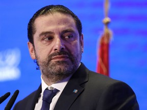 FILE - In this Nov. 23, 2017 file photo, Lebanese Prime Minister Saad Hariri speaks during a regional banking conference, in Beirut, Lebanon. Hariri formally rescinded his resignation following a consensus deal reached with rival political parties. The Tuesday, Dec. 5, 2017,  announcement came at the end of the first cabinet meeting to be held since Lebanon was thrown into a political crisis following Hariri's Nov. 4 surprise resignation from Saudi Arabia.