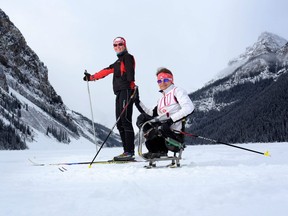 In this Feb. 11, 2014 file photo, Brittany Hudak (left) and Colette Bourgonje pose for a photo at Lake Louise, Alta.