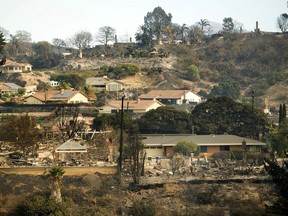 Homes scorched by a wildfire line a hillside in Ventura, Calif., on Wednesday, Dec. 6, 2017.