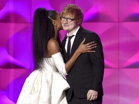 Host Ciara, left, kisses presenter Ed Sheeran at the Billboard Women in Music event at the Ray Dolby Ballroom on Thursday, Nov. 30, 2017, in Los Angeles. (Photo by Chris Pizzello/Invision/AP)