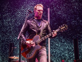 Josh Homme of Queens of the Stone Age performs at the 2017 KROQ Almost Acoustic Christmas at The Forum on Saturday, Dec. 9, 2017, in Inglewood, Calif.
