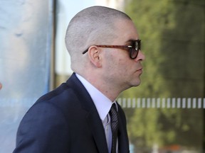 Former "Glee" actor Mark Salling arrives at federal court in Los Angeles on Monday, Dec. 18, 2017. Salling has pleaded guilty to possession of child pornography.