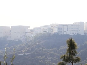 The Getty Center lies shrouded in smoke as seen from the Bel Air district of Los Angeles after the Skirball wildfire swept through Wednesday, Dec. 6, 2017. The Getty Center, the $1 billion home to the J. Paul Getty Museum and related organizations, stands on the west side of Sepulveda Pass. The fire erupted on the east side of the pass, but the plume of smoke curled west, over the Getty. But the Getty would have been prepared even if flames had threatened. Officials have described how fire protection was designed into the facility by architect Richard Meier, including the thickness of the walls and doors to compartmentalize any fire.