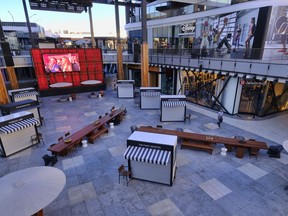 In this Wednesday, Nov. 22, 2017, photo, shops at Westfield Century City Mall prepare for the holiday shopping crowd in the Century City section of Los Angeles. Many malls have spent billions to transform themselves into destinations where shopping is almost secondary, adding swanky dining options, premium movie theaters and other entertainment options.