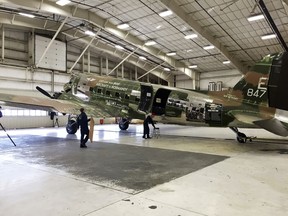 In this Thursday, Dec. 14, 2017, workers help at restoring a C-47 called "That's All, Brother," at Basler Turbo Conversions in Oshkosh, Wis. The plane, which was lost for 70 years and accidentally discovered by an Air Force historian at the Basler junkyard, carried the first paratroopers who stormed the beaches of Normandy during World War II. The group, Commemorative Air Force, started a campaign to restore the relic with hopes to fly the aircraft over Normandy in 2019 for the 75th anniversary of D-Day.