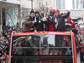 Toronto FC's Sebastian Giovinco (left to right) Victor Vazquez, Jozy Altidore and Michael Bradley hold the MLS Trophy as the team celebrates their victory in the MLS Cup final with a parade through downtown Toronto on Monday, December 11, 2017.