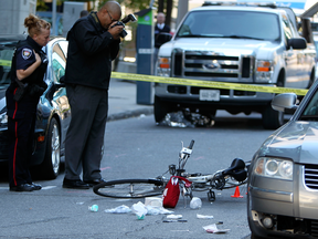 Ottawa police investigate the scene of a fatal accident involving a cyclist and car. Only about 20 per cent of those charged with careless driving in Ontario are convicted, Chris Selley notes.