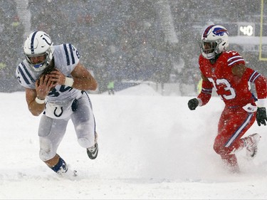 Indianapolis Colts tight end Jack Doyle, left, scores a touchdown during the second half of an NFL football game against the Buffalo Bills, Sunday, Dec. 10, 2017, in Orchard Park, N.Y. (AP Photo/Jeffrey T. Barnes)