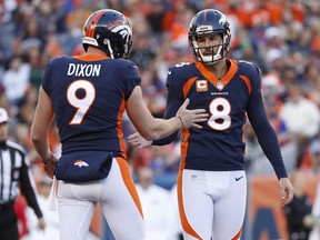 Denver Broncos kicker Brandon McManus (8) celebrates his field goal with punter Riley Dixon (9) during the first half of an NFL football game against the New York Jets, Sunday, Dec. 10, 2017, in Denver.