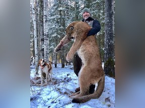 Canadian TV host Steve Ecklund holds a cougar in a photo from his Facebook page.