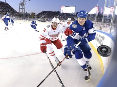 Toronto Maple Leafs forward William Nylander (right) battles Detroit Red Wings forward Gustav Nyquist for the puck in the NHL Centennial Classic in Toronto on Jan. 1.