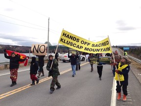 Protesters gather at Cape Breton's Seal Island Bridge to object to mining projects on Kellys Mountain, in New Harris, N.S., on Saturday, Dec. 16, 2017.