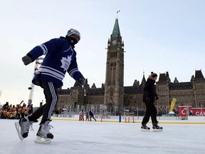 Skaters brave the extreme cold weather conditions on the Canada 150 skating rink on Parliament Hill in Ottawa, Friday, December 29, 2017.