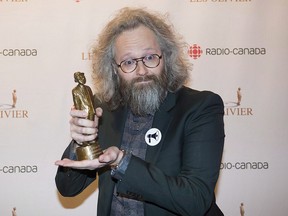 Francois Bellefeuille holds up his trophy at the gala Olivier awards ceremony in Montreal, Sunday, December 10, 2017. The sexual misconduct scandal that has dominated Quebec's entertainment headlines this year was front and centre at the annual awards ceremony honouring the best in Quebec comedy.