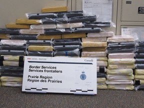 84 bricks of suspected cocaine are shown in Coutts, Alta., in this recent police handout photo. Border guards and Alberta RCMP say they prevented a record amount of drugs from coming crossing into Canada. Officers with the Canada Border Services Agency say they intercepted a commercial truck hauling produce from California at the Coutts, Alta., border crossing about 300 kilometres south of Calgary last weekend.