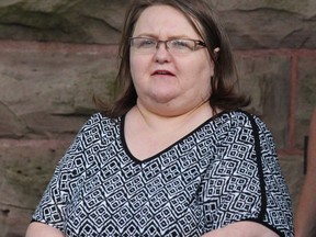 Elizabeth Wettlaufer is escorted by police from the courthouse in Woodstock, Ont, Monday, June 26, 2017. Relatives of murdered seniors, along with advocacy and health-care groups, are among four dozen applicants seeking to participate in the public inquiry sparked by a nurse who killed eight elderly long-term-care residents in Ontario.