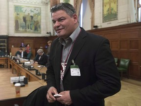 Ontario Regional Chief Isidore Day waits to appear at the Commons Aboriginal affairs committee on Parliament Hill in Ottawa, Thursday, April 14, 2016. Day says he and Quebec Regional Chief Ghislain Picard are leading discussions on how First Nations communities will address the impacts of pot legalization.