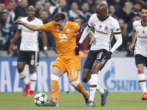 Besiktas' Atiba Hutchinson, right, and Porto's Hector Herrera, left, challenge for the ball during the Champions League Groug G soccer match between Besiktas Istanbul and FC Porto in Istanbul, Turkey, Tuesday, Nov. 21, 2017. Veteran midfielder Hutchinson, who plays his club soccer for Besiktas in Turkey, has been named Canadian male soccer player of the year for the sixth time.