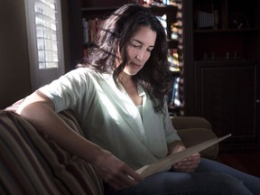 Lesley Barron Kerr sits with a signed letter from The Queen from a 1956 review of holders of the Victoria Cross, in her Vaughan, Ont., home on Monday, November 6, 2017. Kerr's great grandfather was awarded the Victoria Cross for his service at Passchendaele, and would like to buy the medal, which is up for auction.