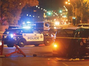 Police investigate the scene where a car crashed into a roadblock in Edmonton on September 30, 2017. Public Safety Canada warns that extremists are increasingly carrying out simple but deadly attacks using knives and vehicles. In its annual public report on the terrorist threat to Canada, the department notes such unsophisticated but "high-impact" assaults took place recently in Edmonton, where five people were injured, and in New York, killing eight people and injuring several more.