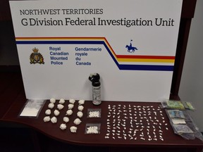 Seized drugs and cash from a human trafficking and drug investigation are shown in this recent handout photo.