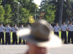 The University of Regina has been commissioned to study the effects of policing on the mental health of RCMP officers. The federal government says the purpose of the 10-year study is to identify psychological and physiological signs of trauma and stress-related disorders, including post-traumatic stress. RCMP cadets line up before a memorial for fallen RCMP officers at Depot Detachment in Regina, Sask., on Sunday, September 13, 2015.