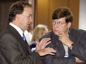 Quebec Justice Minister Marc Bellemarre (left) chats with Alberta Justice Minister David Hancock during a break at a meeting of federal, provincial and territorial justice ministers in La Malbaie, Que., Tuesday Sept. 30, 2003. Hancock has been named a provincial court judge.