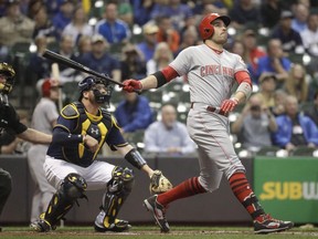 Cincinnati Reds' Joey Votto hits a home run during the first inning of a baseball game against the Milwaukee Brewers Wednesday, Sept. 27, 2017, in Milwaukee. Given Canada's love for all things hockey, Cincinnati Reds star Joey Votto was as surprised to win the Lou Marsh Trophy a second time as he was the first.